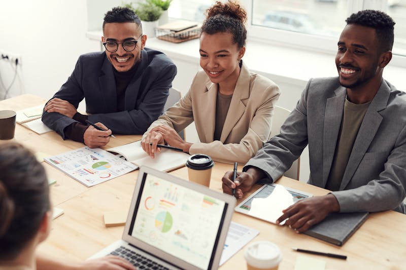 Advisory meeting with smiling professionals